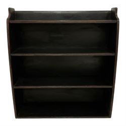 Black painted bookcase, curved form and fitted with three shelves, moulded end supports and shelves, ebonised finish