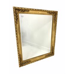 20th century gilt framed wall mirror, floral moulded frame enclosing bevelled plate 71cm x 86cm