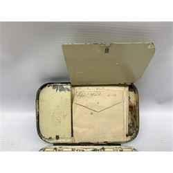 Early 20th century Japanned metal fly box by J Bernard & Son, 45 Jermym Street, St James`s, London, the hinged lid opening to reveal six hinged compartments containing various flies 