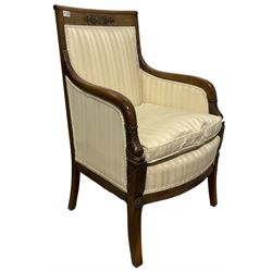 French empire design armchair, the mahogany cresting rail with gilt metal mounts over seat and back upholstered in striped ivory fabric, raised on square tapering supports 