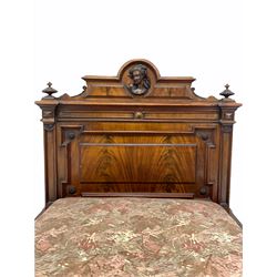 Late 19th century French Empire design mahogany single bed, the head board centred by a carved mask over geometric panels, raised on turned supports with a box base, W98cm, L190cm