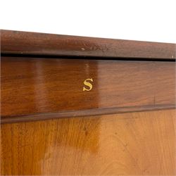 20th century mahogany pedestal collectors filing cabinet, the rectangular top over a single panelled door with a gilt painted 'S' to the top, concealing six graduating drawers with wood handles, raised on plinth base
Provenance: property of a gentleman