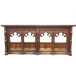 Two oak prayer stands, decorated with floral carving and panels together with two oak communion rails, with gothic style carving and upholstered kneeler 