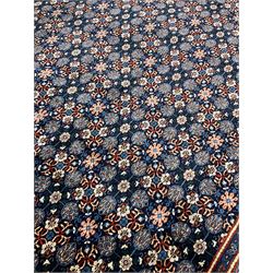 Persian Mahal carpet, indigo ground field decorated with Herati motifs, overall floral design, the guarded border with repeating pattern