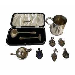 Victorian silver christening mug with leaf capped handle 9cm London 1875, silver spoon and pusher, silver mustard pot and various silver fobs 7.6oz