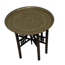 Early 20th century Benares table, circular brass top on hardwood folding base