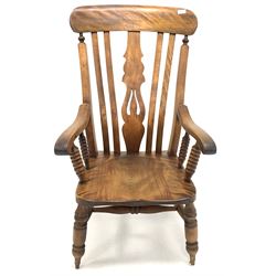 Victorian walnut farmhouse armchair, shaped and pierced splat, saddle seat, raised on turned supports with double 'H' stretcher