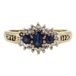 9ct gold three stone sapphire and diamond cluster ring, with diamond set shoulders, hallmarked 