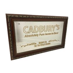 20th century wall hanging mirror, carved gilt frame enclosing bevelled mirror reading 'Cadbury's Absolutely Pure therefore the Best Makers to the King and Queen' 55cm x 91cm