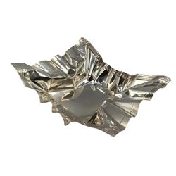 Novelty silver dish by Rebecca Joselyn modelled as a crumpled crisp packet 16cm x 14cm, hallmarked Sheffield 2013. Rebecca Joselyn studied at Sheffield Hallam University and graduated in 2006. She has won numerous awards for her 'From the Shed' and 'Packaging' collections