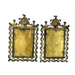 Pair of Victorian brass framed wall mirrors, each of upright rectangular form, cast with pierced floral and ribbon garlands, surmounted by a classical mask and flanked by two urns  of flowers, each with bevelled glass plates, H38.5cm x W23.5cm