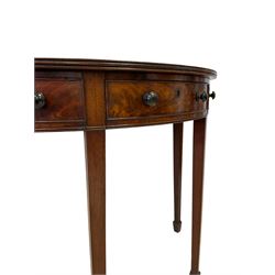 George III mahogany demi-lune side or console table, reeded edge over central frieze drawer flanked by two hinged drawers with cock-beaded facias and turned handles, raised on square tapering supports with spade feet, the rear supports and feet chamfered in profile