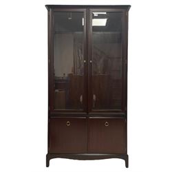 Stag Minstrel - mahogany display cabinet two cupboard doors and sides glazed with bevelled plates, enclosing three shelves, double cupboard fitted to base