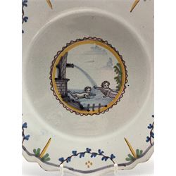Pair of Faience ware polychrome plates, centrally decorated with Cherubs swimming within an foliate border, D22.5cm