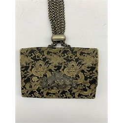 Japanese Meiji silk tobacco pouch (tabako-ire) embroidered with dragons amongst clouds, metal mae-kanagu in the form of a Dragon and multiple adjustable chain to kagamibuta inset with Dragon mount, L12.5cm 