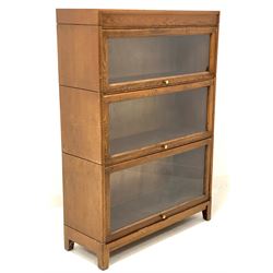 Mid 20th century oak stacking library bookcase, three shelves with glazed up and over doors, raised on square tapered supports W87cm, H123cm, D31cm