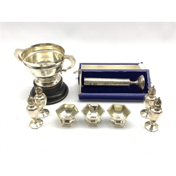 Small silver two handled trophy 'Yorkshire Automobile Club 1924', four Sterling silver pepperettes, three salts and a silver cylindrical vase 