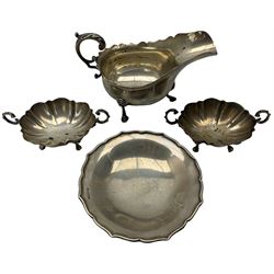 Silver sauce boat with C scroll handle and triple shaped supports London 1927 Maker P G Dodd & Son and three various silver sweetmeat dishes