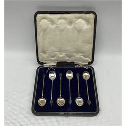 Pair of engine turned serviette rings, cased and engraved with initials Birmingham 1929, pair of plain silver serviette rings, set of six silver coffee spoons with figure finials Sheffield 1935 Maker Thomas Bradbury, six bead knop coffee spoons and six silver handled pastry knives approx 7oz
