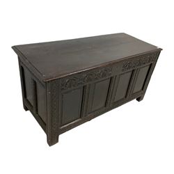 18th century dark oak coffer or chest, rectangular hinged lid with moulded edge, the frieze carved with lunettes and fleur-de-lis design, panelled front and sides with fluted uprights with carvings