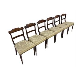 Near set of six Victorian mahogany dining chairs, the scrolled cresting rail and reeded back terminals flanking a carved back rail, over a seat upholstered in ivory floral fabric, raised on reeded and turned supports 
