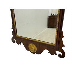 19th century mahogany Chippendale design fretwork wall mirror, the pediment carved and pierced with hoho bird, bevelled mirror plate in moulded frame with carved and gilt inner slip, the lower apron carved with shell motif
Provenance: From the Estate of the late Dowager Lady St Oswald