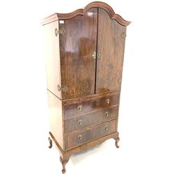 Early 20th century figured walnut dome top millinery cupboard, two doors enclosing interior fitted with sliding trays, three drawers under, raised on carved cabriole supports W90cm, H180cm, D52cm