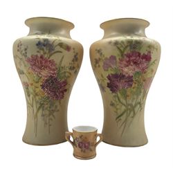 Pair of Royal Worcester blush ivory vases painted with flowers, circa 1910 shape no. 2195 together with a Royal Worcester blush ivory miniature tyg (3)