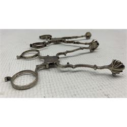 Two pairs of early 19th century silver scissor action sugar nips