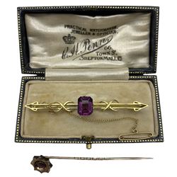 Purple paste bar brooch, stamped 9ct, and a ruby stick pin (2)