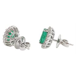 Pair of 18ct white gold oval emerald and round brilliant cut diamond stud earrings, total emerald weight 2.55 carat, total diamond weight 0.75 carat