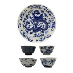 18th Chinese tea bowl with a fisherman and verse, four character mark, two other tea bowls, a small blue and white bowl and a Chinese plate with dragons etc (5)