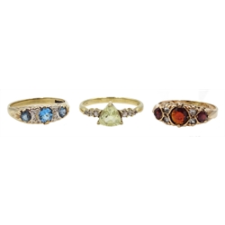 Gold garnet set ring, diamond and blue zircon ring and one other, all hallmarked 9ct