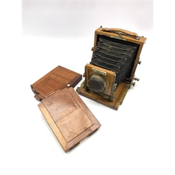 19th/ early 20th century mahogany and brass-bound 'The 1900 Patent Instantograph' quarter plate camera by J. Lancaster & Son, Birmingham, with a Benetfink & Co. lens and two additional plates
