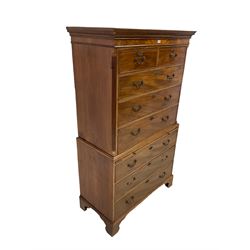 George III mahogany chest-on-chest, dentilled cornice over two sort and three long drawers flanked by reeded canted edges, the lower section fitted with brushing slide over three drawers, raised on bracket feet