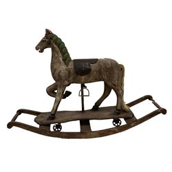 Small rocking horse, with leather saddle raised on a rocking base 