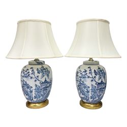 Pair of lamps of baluster form, decorated with a Japanese landscape on a white ground  raised upon a gilt footed base, including shades H60cm
