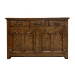 20th century oak sideboard, fitted with three drawers over two cupboard doors, opening to reveal one shelf, raised on stile supports 