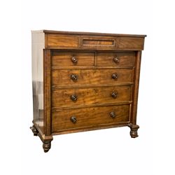 Scottish Victorian mahogany chest of drawers, the projecting frieze cupboard over two short and thee long cupboards flanked by two octagonal pilasters, raised on turned supports W150cm