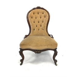 Victorian spoon back chair, with floral carved cresting rail over deep buttoned upholstered back, raised on floral carved and scrolled cabriole supports terminating in castors, W54cm 