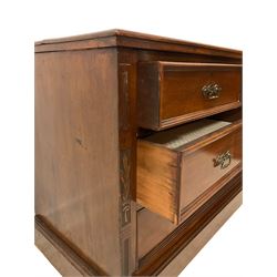 Late Victorian walnut chest, moulded rectangular top over two short and two long drawers, the uprights carved with flowers and decorated with reeding, on moulded plinth base 