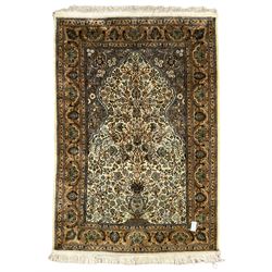 Persian Isfahan rug, the mihrab enclosing tree of life design with urn, all-over floral decoration, multiple band border with repeating design