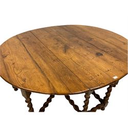 19th century oak drop-leaf dining table, oval top with quadruple gate-leg action base, spiral turned supports united by spiral turned stretchers