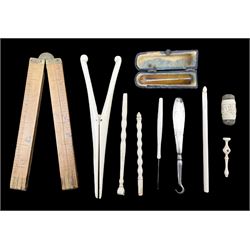 19th century carved ivory double ended pin cushion, pair of 19th century bone glove stretchers, 19th century folding rule by Smallwood, Birmingham, 19th century bone Stanhope in the form of a hand, amber cheroot holder etc 