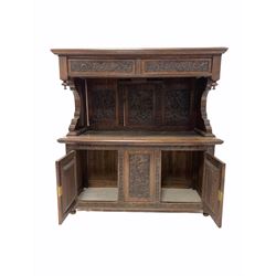 Early 20th century oak buffet side cabinet, the raised back with moulded top over two drawers, three panel back and two cupboards under, raised on turned supports, profusely carved with foliate all over W123cm, H126cm, D49cm