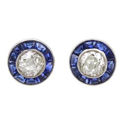 Pair of 18ct white gold and platinum milgrain set, calibre cut sapphire and old cut diamond target stud earrings, total diamond weight approx 1.00 carat