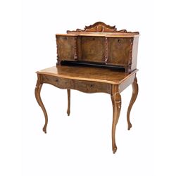 Late 19th century figured walnut Bonheur de jour, scrolled and arched raised back with three cupboards, serpentine moulded main section fitted with two drawers, raised on cabriole supports 
Provenance: This item is thought to have belonged to Lord Londesborough, being sold at auction in the early 20th century 