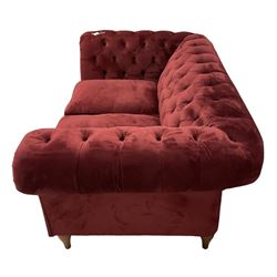 Two seat Chesterfield sofa, upholstered in buttoned red velvet with loose seat cushions, retailed by John Lewis
