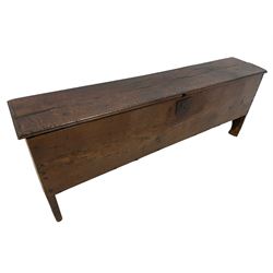 17th century 6' 2'' oak six plank sword chest, moulded rectangular hinged lid with carved edge, with wrought iron lock and fittings, raised on reentrant end supports