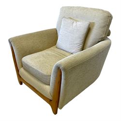 Ercol - light elm framed two seat sofa upholstered in cream fabric (W152cm, H97cm, D87cm); and matching armchair (W97cm, H93cm, D97cm)